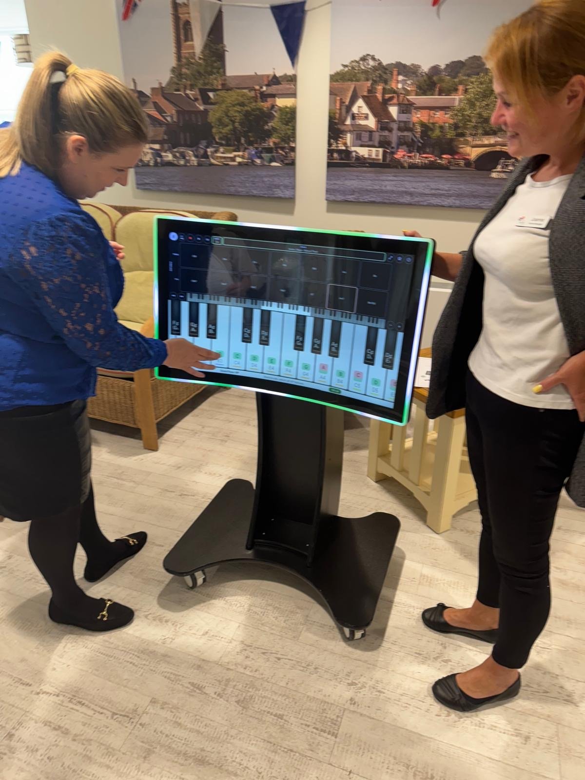 Engaged children learning on an interactive touchscreen in a Leeds nursery